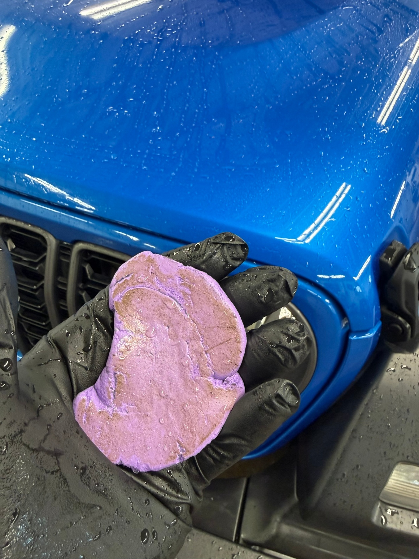 Clay decontamination removing embedded fallout from Jeep paint